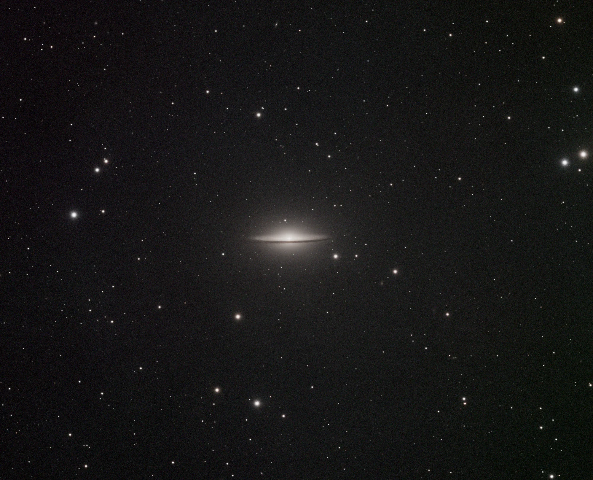 The Sombrero Galaxy with its bright core and dark equatorial dust lane
